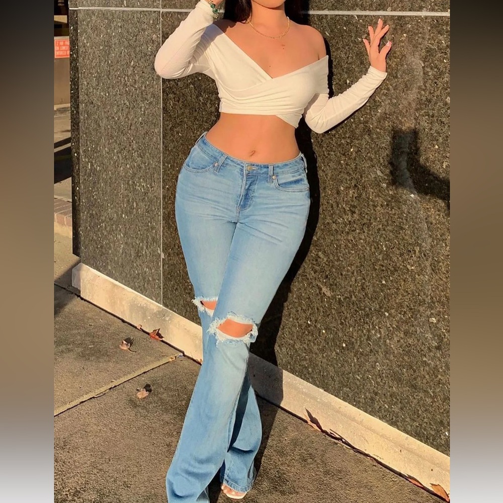 Mid rise distress light blue jeans